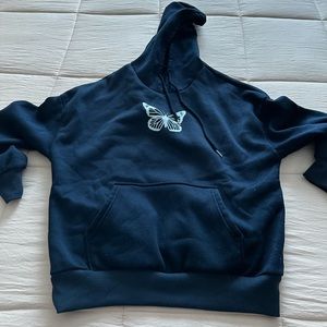 Dark blue comfortable sweatshirt with butterfly detail